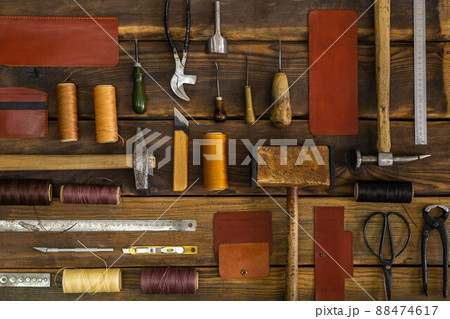 Top view materials and instruments on cutting mat for chopping measurement leatherwork details 88474617