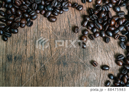 Roasted coffee bean flat lay on wood background Roasted coffee bean flat lay on wood background 88475983