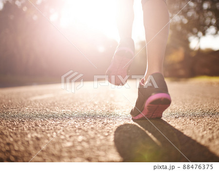 Train like theres no finish line. Cropped shot of a womans legs out for a run. Train like theres no finish line. Cropped shot of a womans legs out for a run. 88476375