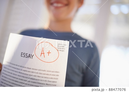 Easy A. Shot of a proud young boy holding up his essay that got him an A+. Easy A. Shot of a proud young boy holding up his essay that got him an A+. 88477076