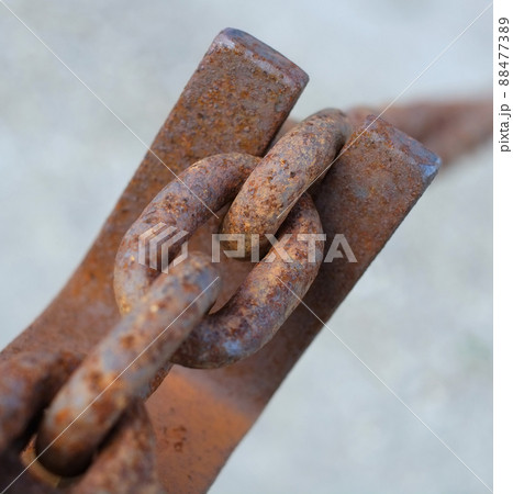 A chain is only as strong as the weakest link.... Closeup of a rusty cable chain. A chain is only as strong as the weakest link.... Closeup of a rusty cable chain. 88477389