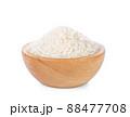 Rice in a wooden cup on a white background. 88477708