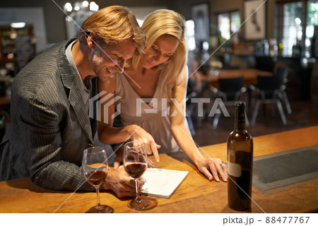 this was a good year. Shot of a couple enjoying a wine tasting. 88477767