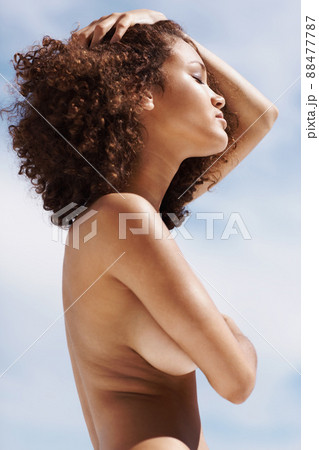 Passionate posing. Passionate topless woman posing outdoors. 88477787