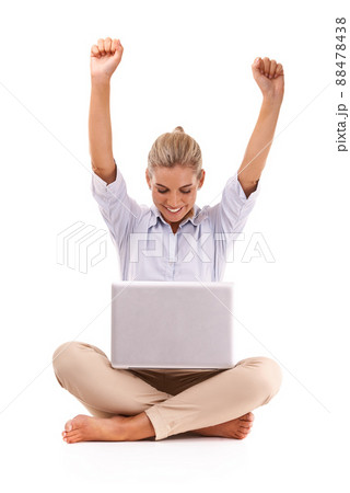 Success. An attractive young woman cheering while sitting in front of her laptop. Success. An attractive young woman cheering while sitting in front of her laptop. 88478438