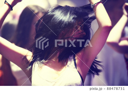 Dancing the night away. A young woman dancing. 88478731