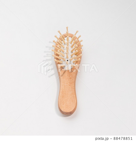 Wooden mini bamboo hair brush for travel, beard or kids on white background. Small pocket brush Wooden mini bamboo hair brush for travel, beard or kids on white background. Small pocket brush 88478851