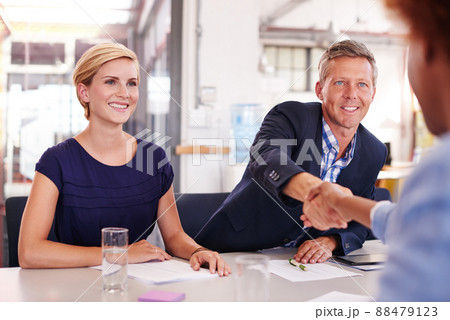 Youve got yourself a deal. Cropped shot of three businesspeople in an office. Youve got yourself a deal. Cropped shot of three businesspeople in an office. 88479123