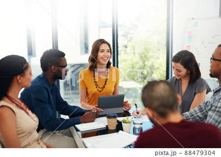 Giving them the rundown. Cropped shot of a group of businesspeople in a meeting. Giving them the rundown. Cropped shot of a group of businesspeople in a meeting. 88479304