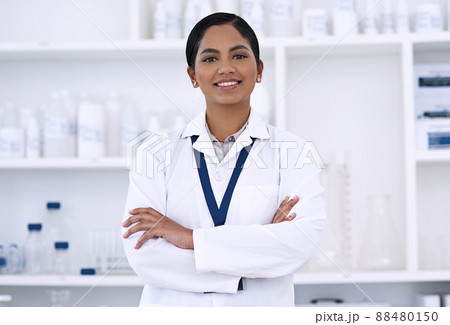 Im confident in my scientific ability. Cropped portrait of an attractive young female scientist standing with her arms folded in the lab. 88480150
