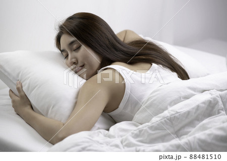 Asian woman sleep and sweet dream on bed in bedroom in the morning feeling so relax and comfortable Asian woman sleep and sweet dream on bed in bedroom in the morning feeling so relax and comfortable 88481510