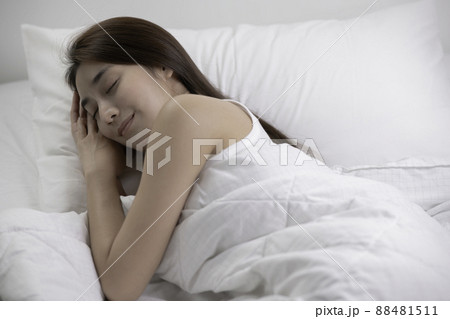 Asian woman sleep and sweet dream on bed in bedroom in the morning feeling so relax and comfortable 88481511