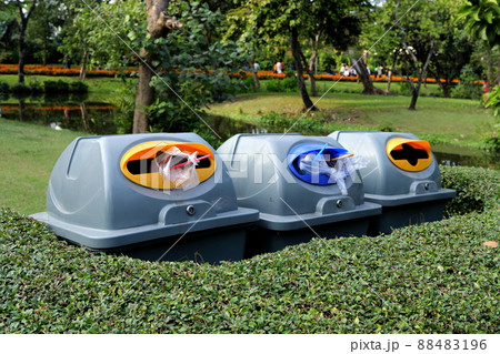 Bins and garbage in pubic park. Bins and garbage in pubic park. 88483196
