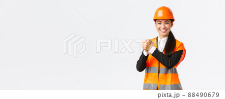 Successful winning female asian architect shaking hands together, achieve goal. Chief construction manager celebrating victory, finish of building works, standing white background delighted Successful winning female asian architect shaking hands together, achieve goal. Chief construction manager celebrating victory, finish of building works, standing white background delighted 88490679