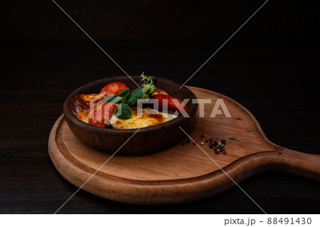 Homemade traditional Georgian dish in a pot with baked vegetables. Tasty food. Dish of oriental cuisine. Homemade traditional Georgian dish in a pot with baked vegetables. Tasty food. Dish of oriental cuisine. 88491430