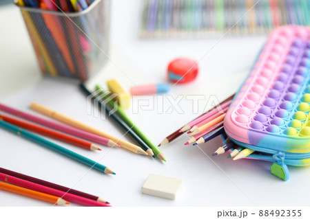 Stationery pencils wash and multicolored pencil case closeup Stationery pencils wash and multicolored pencil case closeup 88492355