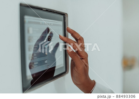 African woman using smart home screen control system African woman using smart home screen control system 88493306