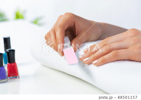 Woman using nail file and create nails shape 88501157