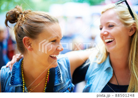 Having fun with my best friend. Two friends having fun at a festival. 88501248