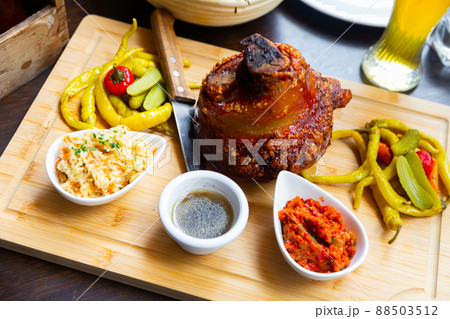 Popular dish of Austrian cuisine is roasted pork knuckle in beer sauce 88503512