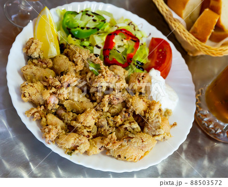 Chipirones battered fried baby squid Chipirones battered fried baby squid 88503572