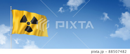 radioactive nuclear symbol flag isolated on a blue sky. Horizontal banner radioactive nuclear symbol flag isolated on a blue sky. Horizontal banner 88507482