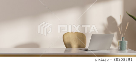 Minimal workspace interior with laptop computer and copy space on white tabletop 88508291
