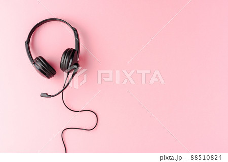 Overheadshot of headset on background with copyspace. Call center concept 88510824