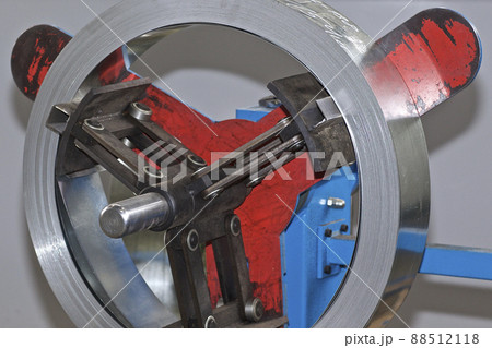 Thin galvanized metal tape in a roll on the drum Thin galvanized metal tape in a roll on the drum 88512118