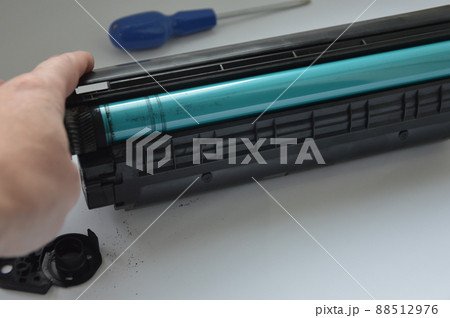 Charging the laser printer cartridge with toner powder 88512976