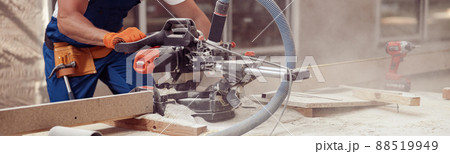 Man builder using wood cutting circular saw machine Man builder using wood cutting circular saw machine 88519949