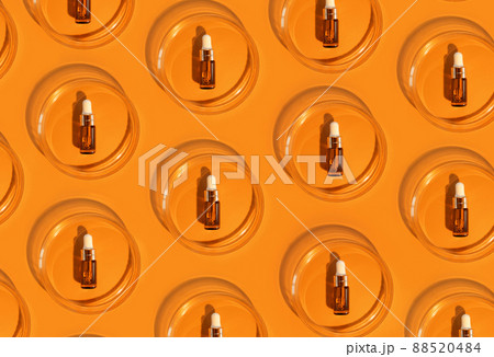 Amber bottle. Laboratory glass petri dish with pipette of water, serum, oil, beauty product. Natural medicine, cosmetic research, bio science. Pattern. Skincare and analysis concept. Dermatology Amber bottle. Laboratory glass petri dish with pipette of water, serum, oil, beauty product. Natural medicine, cosmetic research, bio science. Pattern. Skincare and analysis concept. Dermatology 88520484