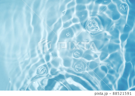 Circles on water. Blue round shadows. Blurred background made with water and light in monochrome. Pureness and freshness concept. Circles on water. Blue round shadows. Blurred background made with water and light in monochrome. Pureness and freshness concept. 88521591