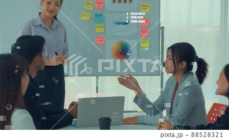 Business people in corporate staff meeting with envisional graphic 88528321