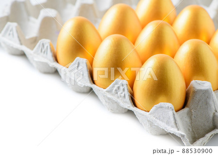 golden eggs in egg tray isolated on white background, success golden eggs in egg tray isolated on white background, success 88530900