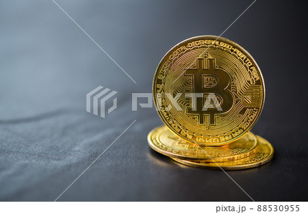Cryptocurrency golden bitcoin coin on black stone background, 88530955