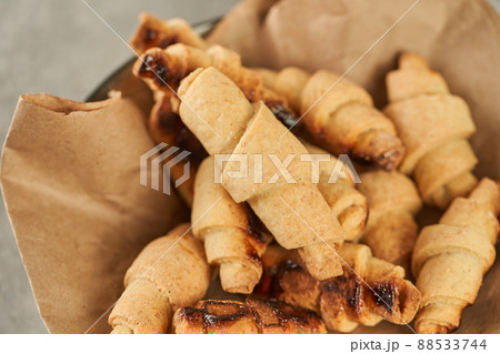 Russian slavic traditional pastry called roguelikes. Cakes bagels. Crispy croissants. Food on grey background, Closeup view 88533744