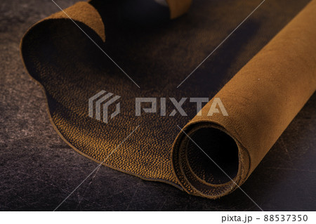 Roll of natural brown leather. Material for manufacture of bags, shoes, clothing and accessories. 88537350