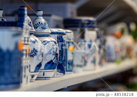 Amsterdam, Netherlands, April 2022. Close up of souvenirs of delft blue pottery. Amsterdam, Netherlands, April 2022. Close up of souvenirs of delft blue pottery. 88538218
