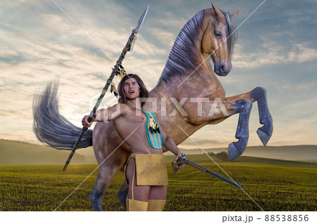 雄々しく前足をあげる馬を背にインディアンの筋骨隆々の若者が槍を持って叫ぶ 88538856