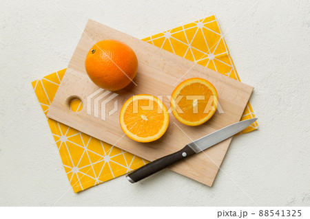 Fresh ripe oranges on cutting board on table. Top view Flat lay 88541325