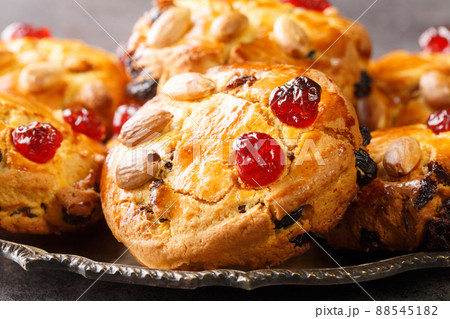English Fat Rascals scones with dried fruits and almonds close-up in a plate. horizontal English Fat Rascals scones with dried fruits and almonds close-up in a plate. horizontal 88545182