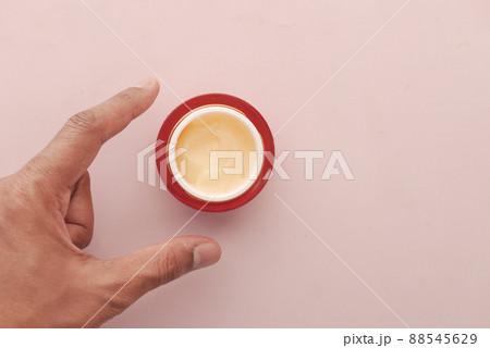 man applying beauty cream onto skin man applying beauty cream onto skin 88545629