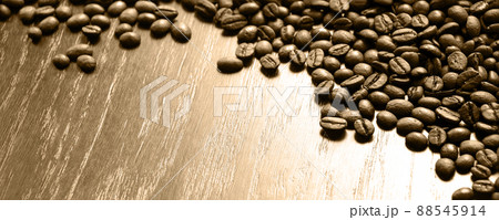 Coffee grains on a wooden table Coffee grains on a wooden table 88545914