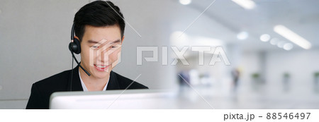 Business people wearing headset working in office in widen view Business people wearing headset working in office in widen view 88546497