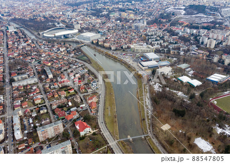 Aerial above view of river crossing the city 88547805