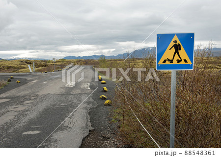 Diver crossing road sign, Iceland 88548361