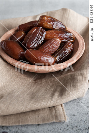 Algerian dates deglet nour on a light background in a bowl 88548844