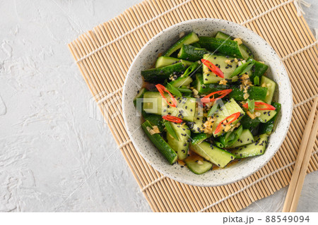 Asian spicy salad Broken Cucumbers with fresh coriander, ginger, pepper chili, black vinegar. 88549094