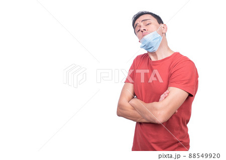 Irresponsible man with misplaced medical mask during COVID pandemic Irresponsible man with misplaced medical mask during COVID pandemic 88549920